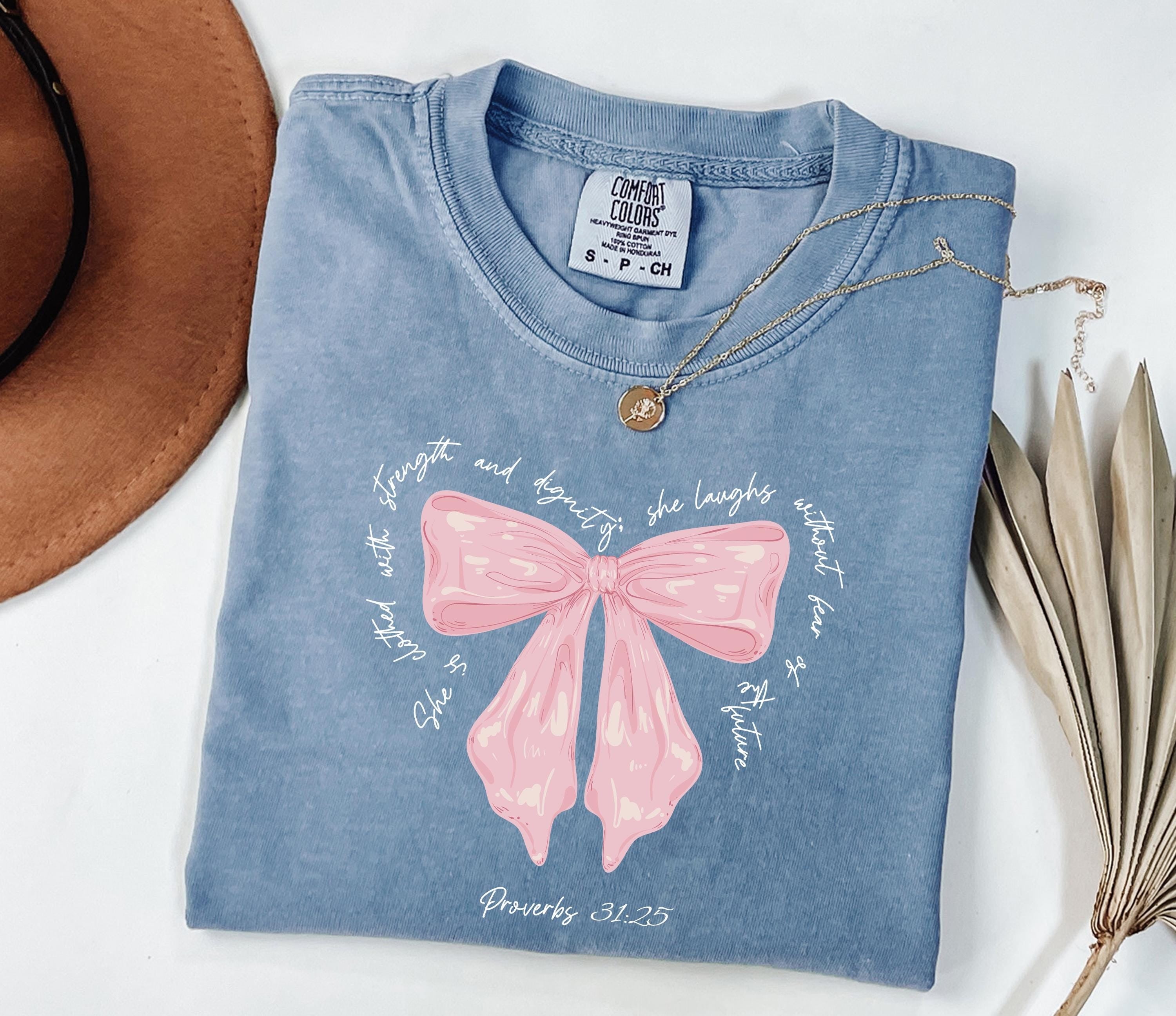 Comfort Colors® She Is Clothed With Strength Proverbs 31:25 Coquette Shirt, Bible Verse Shirt For Her, Cute Christian Gift, Mother's Day Gift, Coquette Mommy